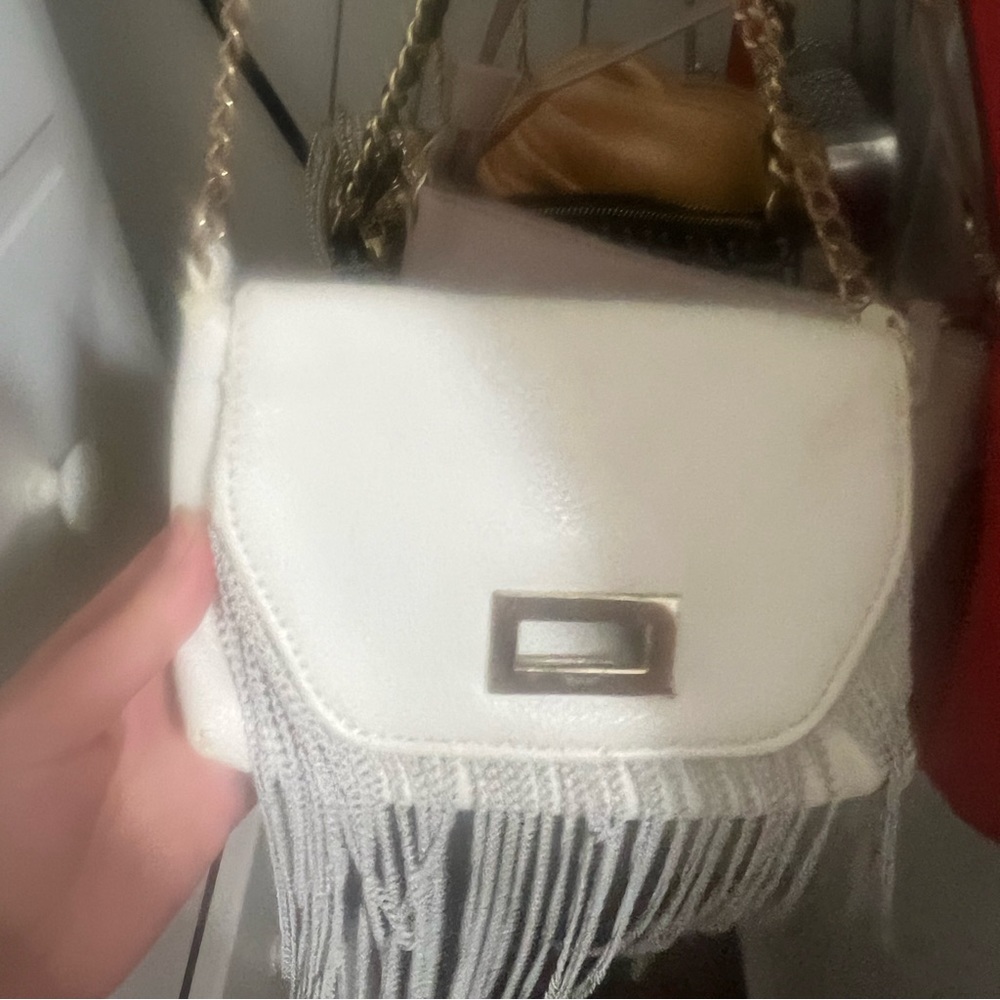 White purse with silver design